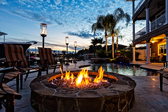 Resort-style pool with spa spillover in Pelican Bay, Naples FL