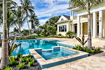 Screened lanai pool with paver deck in Marco Island, FL